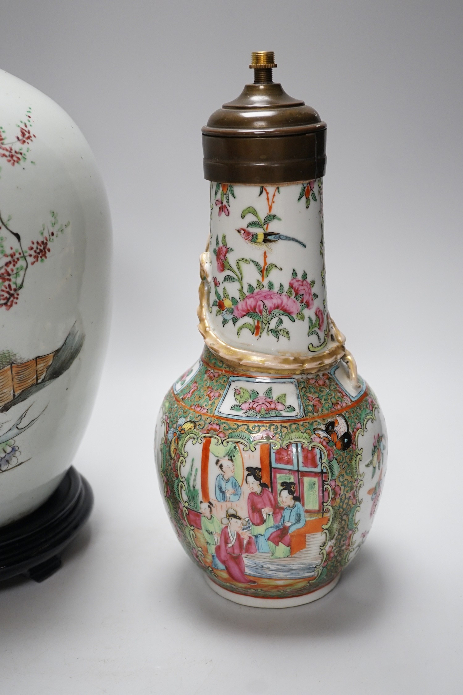 A Chinese famille rose vase converted to a lamp, 26cm, and a larger Chinese vase/lamp base, on stand, 41cm high